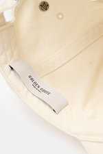 Inside view of the Golden Goose Baseball Cap cream showing twill cotton fabric, star-shaped stud, tonal logo, and adjustable closure.

Description: <p>Authentic style with personality: With a distinctive vintage design, this cap from GOLDEN GOOSE becomes 