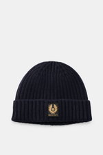 Front view of Belstaff Wool beanie 'Watch' navy in pure wool, featuring soft touch, casual rib knit look, wide turn-up, and woven BELSTAFF label.