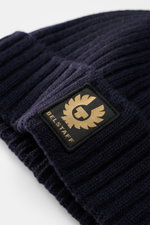 Close-up front view of Belstaff Wool beanie 'Watch' navy in pure wool with soft touch, casual rib knit look, wide turn-up, and woven BELSTAFF label.