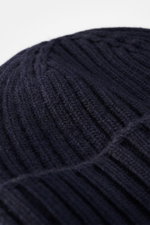 Close-up top-down view of the Belstaff Wool beanie 'Watch' navy, showing pure wool material with soft touch, casual rib knit look, wide turn-up, and woven BELSTAFF label on the front.