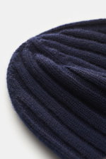 Close-up top-side view of Brunello Cucinelli Cashmere beanie navy, luxurious rib knit with decorative turn-up, pure cashmere, soft touch.