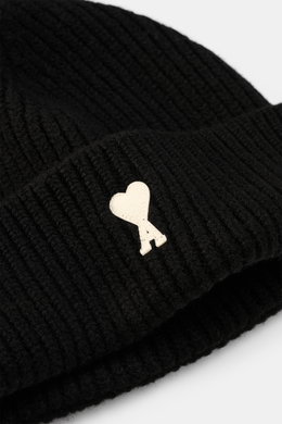 Close-up front angle of Ami Paris Wool beanie black showing pure virgin wool, slightly grippy texture, classic rib knit pattern, wide cuff, and typical logo patch.