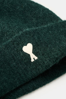 Close-up view of the Ami Paris Beanie dark green showing the soft, elastic rib knit fabric and the white heart logo patch on the wide cuff.

Description: In autumn and winter, this stylish beanie with the typical heart logo by AMI PARIS completes your loo