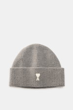 Ami Paris Beanie grey shown from a front perspective, featuring a wide cuff with a typical heart logo patch, soft rib knit in alpaca, wool, and microfiber blend. In autumn and winter, this stylish beanie completes your look and keeps your head warm with e