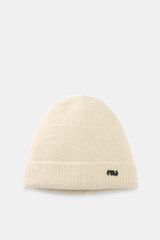 Massimo Osti Studio Beanie sand shown from front, soft mix of wool and microfiber, classic rib knit pattern, cuff with logo detail.