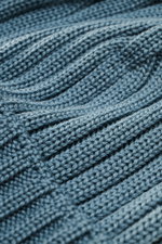 Close-up top-down view of C.P. Company Wool beanie smoky blue showing pure virgin wool, soft touch, classic rib knit pattern, medium coarse knit texture, and cuff with logo patch.