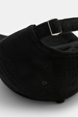 Close-up rear view of the Officine Générale Wool baseball cap 'Jason Cap Double Split' black, showing the adjustable closure on pure wool, soft touch, classic six-panel design.