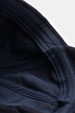 Close-up interior view from above of the Officine Générale Wool baseball cap 'Jason Cap Double Split' navy, showing pure wool, soft touch, classic six-panel design, and adjustable closure.