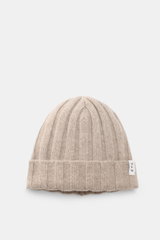 Top-down view of the FTC Cashmere beanie sand, a luxurious rib knit winter accessory in pure, soft Fair Trade cashmere with a medium-fine brioche pattern and a variable brim featuring an FTC woven label.
