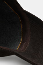 Close-up interior view of Moorer Cashmere Baseball Cap 'Robinson' dark brown melange, showing pure cashmere, soft touch, classic six-panel design, soft lining fabric, and adjustable closure.
