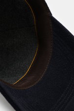Close-up view from above of the inside of the Moorer Cashmere Baseball Cap 'Robinson' navy, showing pure cashmere material, soft touch, classic six-panel design, soft lining fabric, and adjustable closure.