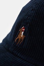 Close-up side view of Polo Ralph Lauren Corduroy baseball cap navy in pure cotton corduroy showing signature logo stitching.

<p>This classic baseball cap by POLO RALPH LAUREN in chic cotton corduroy with signature logo stitching is a perfect for sporty o