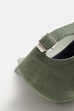 Close-up rear view of the 04651/ A trip in a bag Corduroy baseball cap sage, showing the adjustable closure, corduroy made of elastic cotton with characteristic texture, and classic six-panel design.