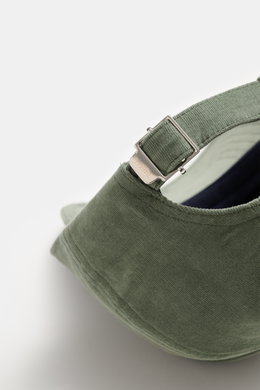 Close-up rear view of the 04651/ A trip in a bag Corduroy baseball cap sage, showing the adjustable closure, corduroy made of elastic cotton with characteristic texture, and classic six-panel design.