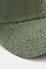 Close-up front view of 04651/ A trip in a bag Corduroy baseball cap sage, showing corduroy made of elastic cotton, characteristic texture, classic six-panel design, and adjustable closure.