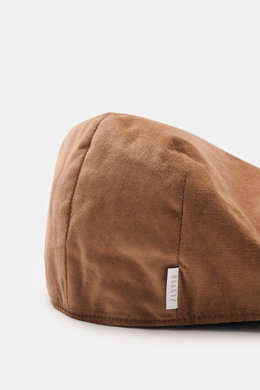 04651/ A trip in a bag Cord Beret braun aus elastischer Baumwolle, materialtypischer Griff, verstärkte Front, tonaler Futterstoff, Nahaufnahme von oben.