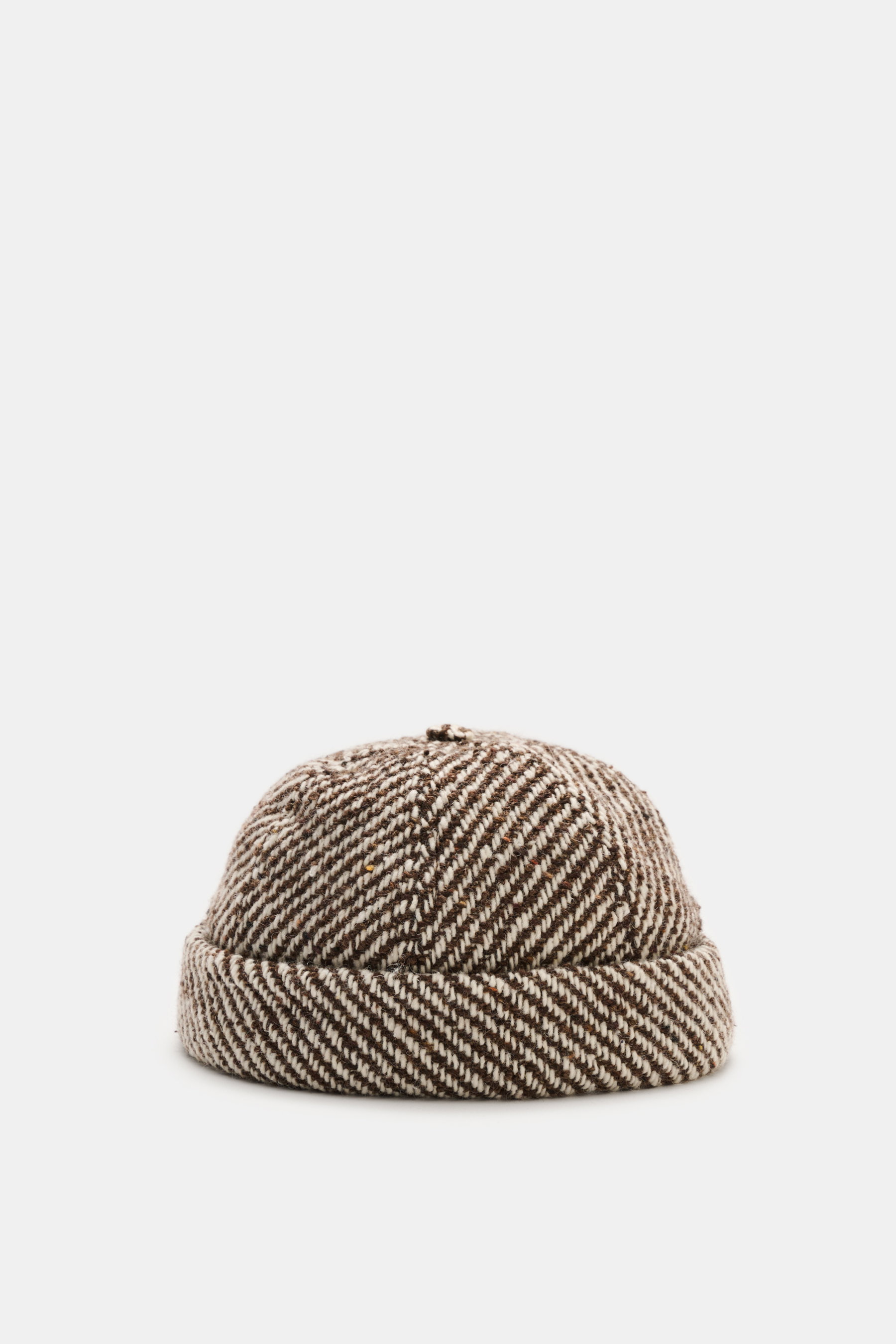 Front view of the 04651/ A trip in a bag Sailor cap 'Fancy Twill' brown/offwhite melange, showing mix of wool and high-quality microfiber, typical material feel, classic six-panel design, and adjustable closure.