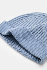 Close-up, angled view of the 04651/ A trip in a bag Wool Hat 'Foggy' Grey-Brown showing pure virgin wool, patent knit, soft touch, medium coarse knit pattern, and narrow cuff.