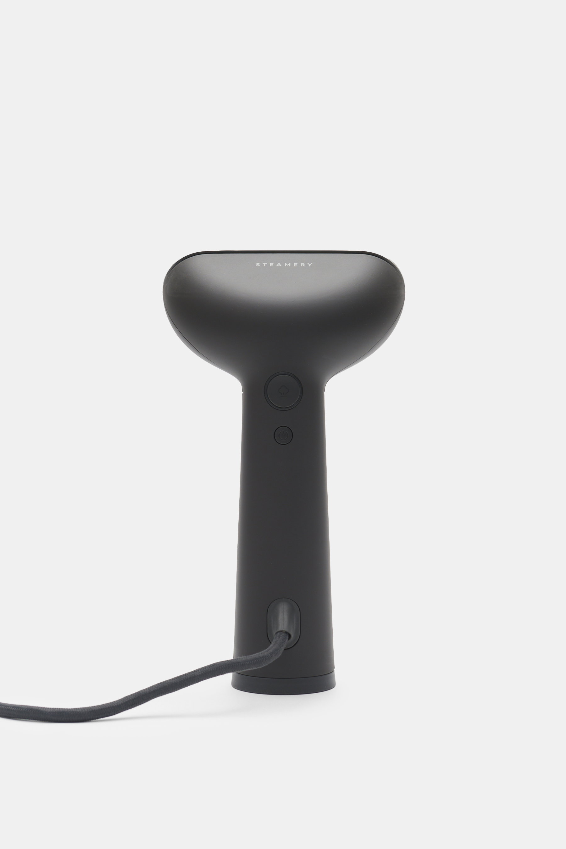 Front view of Steamery Hand steamer 'Cirrus No. 3' anthracite in black, compact with on/off buttons and power cord.

Description: Stay crease free at home and away: The compact hand steamer 'Cirrus No. 3' from STEAMERY is a steamer-iron hybrid – its hot s