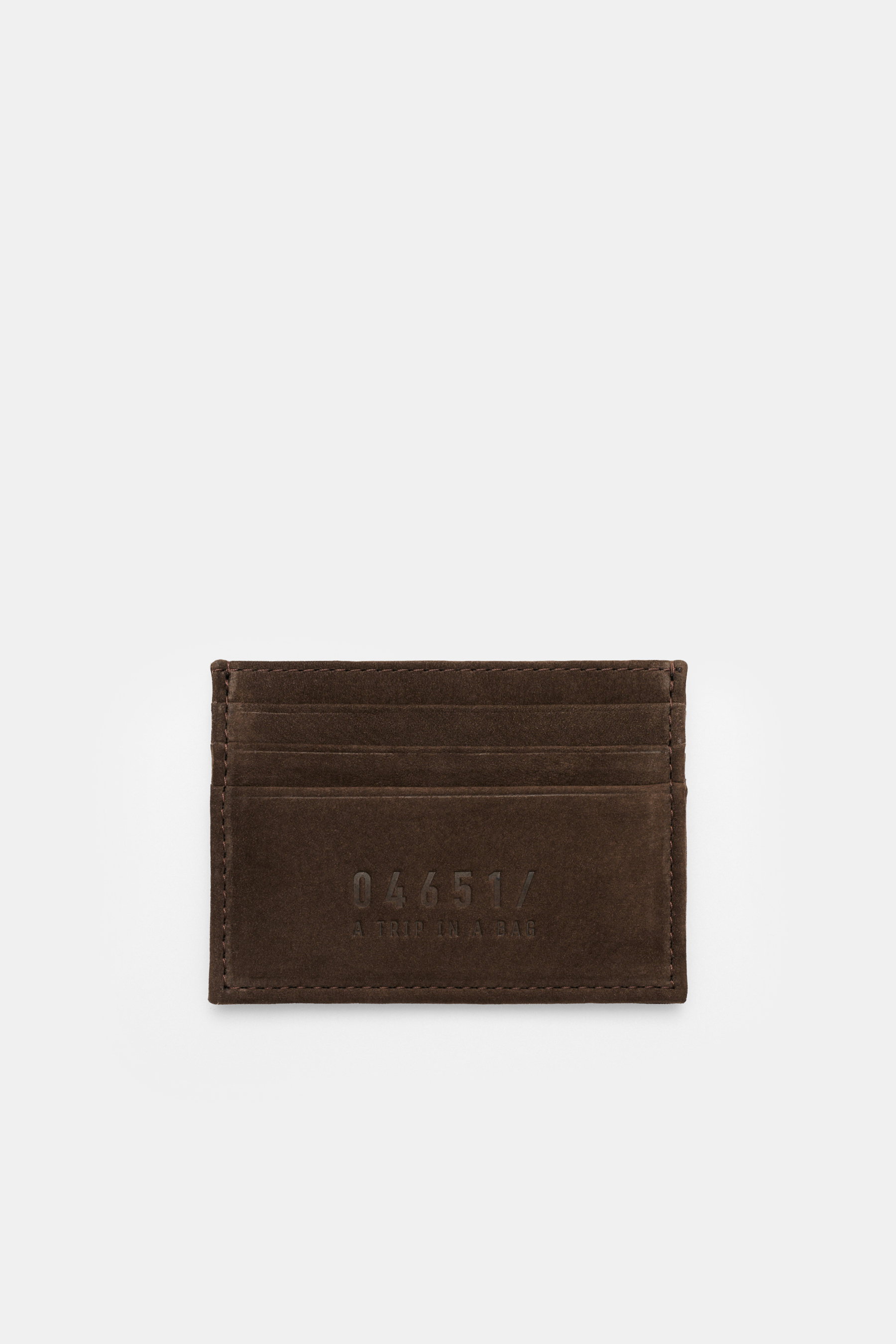 Top-down view of the 04651/ A trip in a bag Credit card holder dark brown in premium suede with six card pockets, main compartment, and embossed logo, approx. 10 x 8 cm.