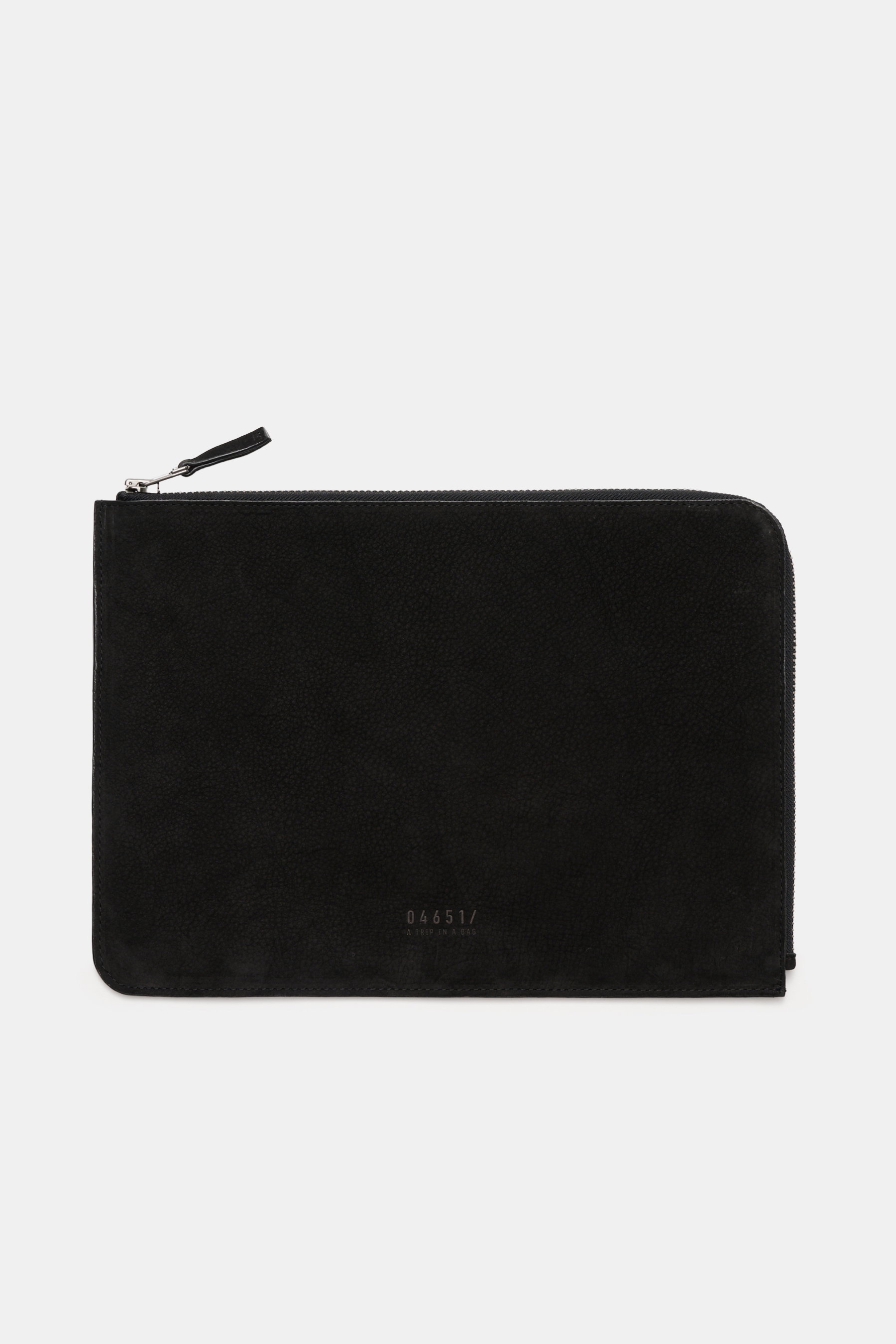 Top front view of the 04651/ A trip in a bag Laptop Sleeve black, made of noble nubuck leather with a smooth grip, zipper, and embossed logo.

Description: 
<p>Effective protection for your 14" laptop: This padded and softly lined leather case by 04651/ A