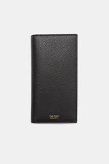 Tom Ford Portemonnaie schwarz aus genarbtem Kalbleder, goldfarbene Prägung, robuste Hardware, frontale Nahaufnahme, Maße ca. 9,5x18x2 cm.