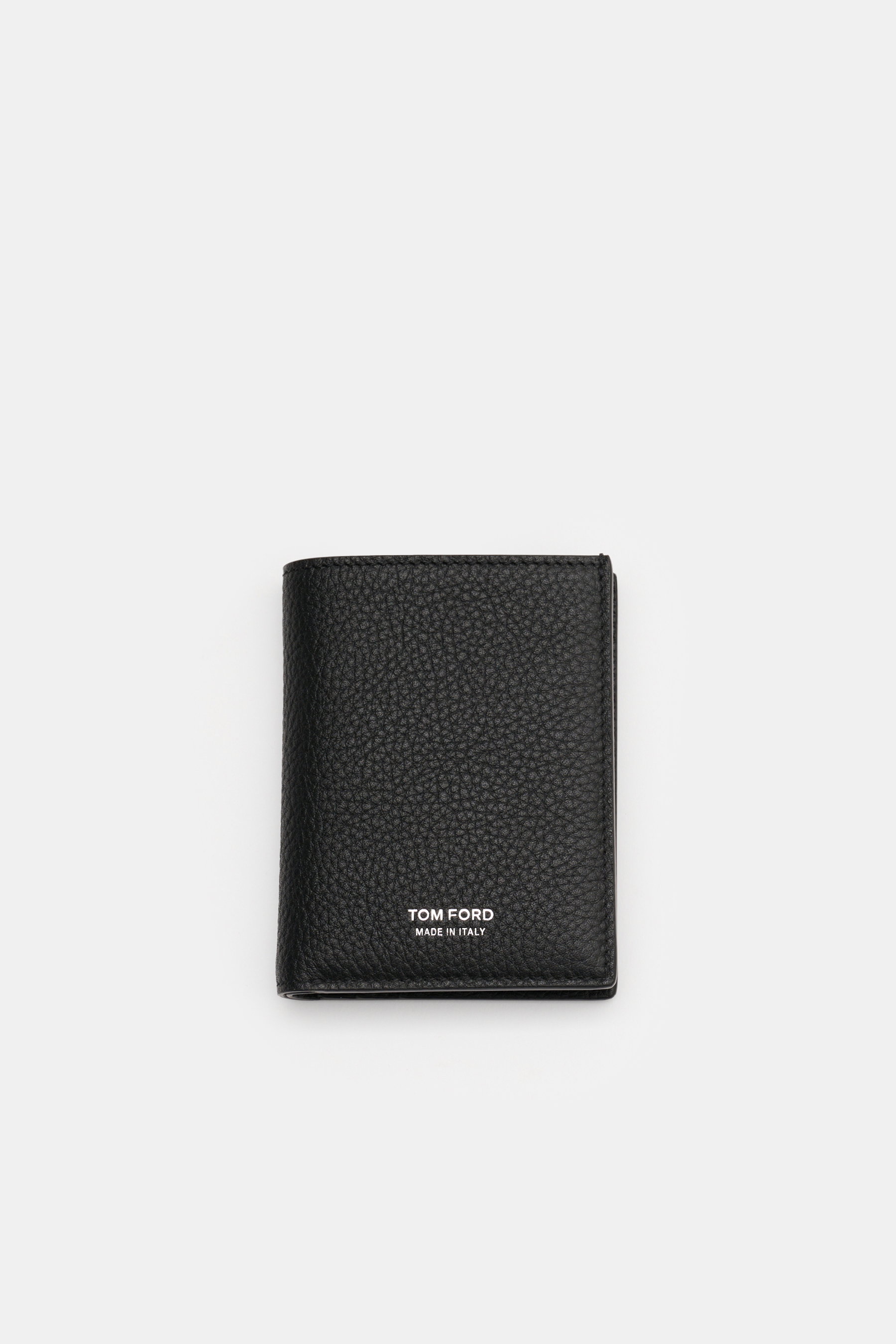 Tom Ford Portemonnaie schwarz aus edlem, markant genarbtem Kalbleder mit silberner Logo-Prägung, frontal, kompakt und minimalistisch.