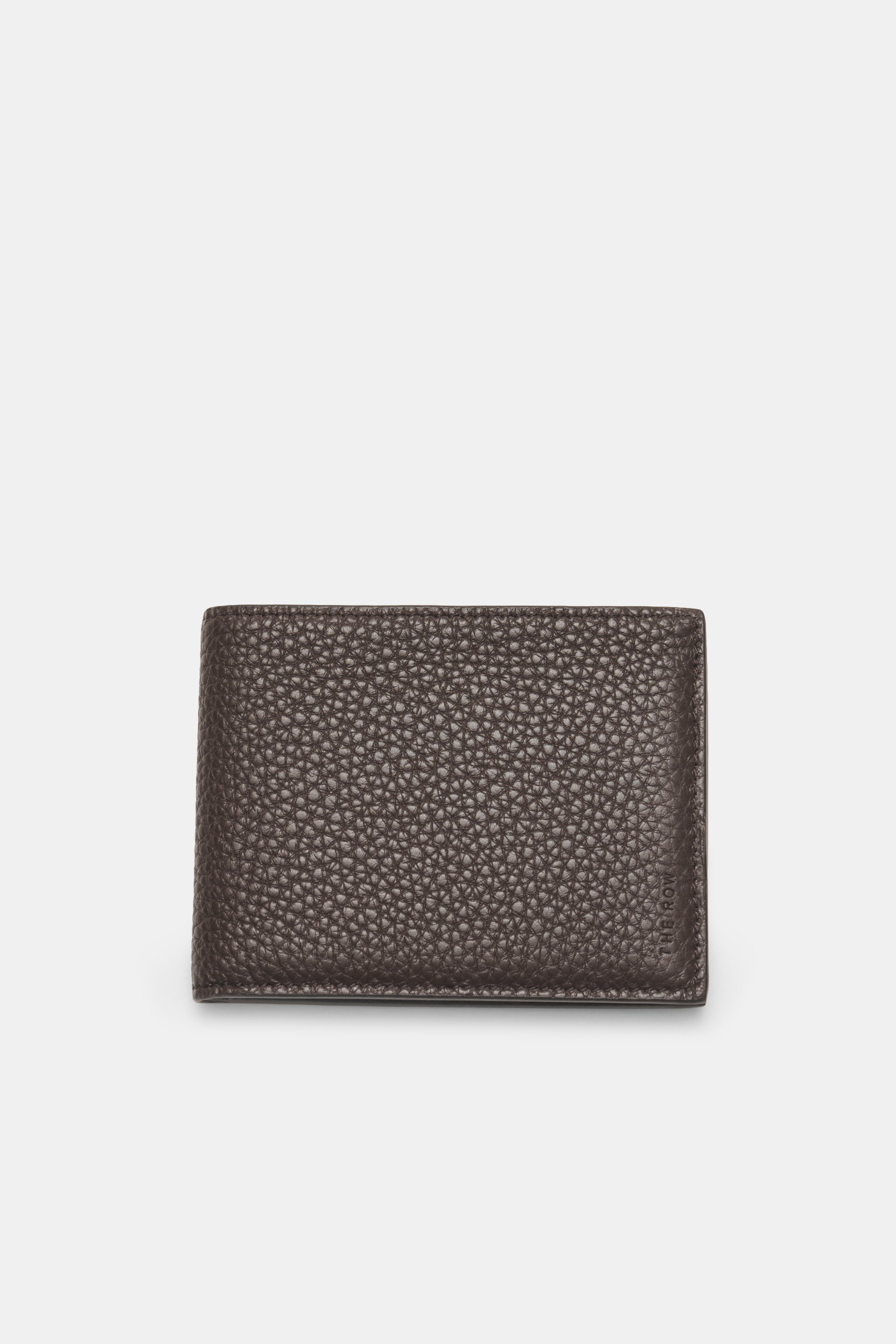 Front view of The Row Wallet 'Classic Wallet' dark brown made of finely grained leather with embossed logo, six card slots, one banknote compartment, approx. 11 cm x 8.5 cm.  

Description: 
<p>The epitome of discreet luxury: This wallet by THE ROW combin
