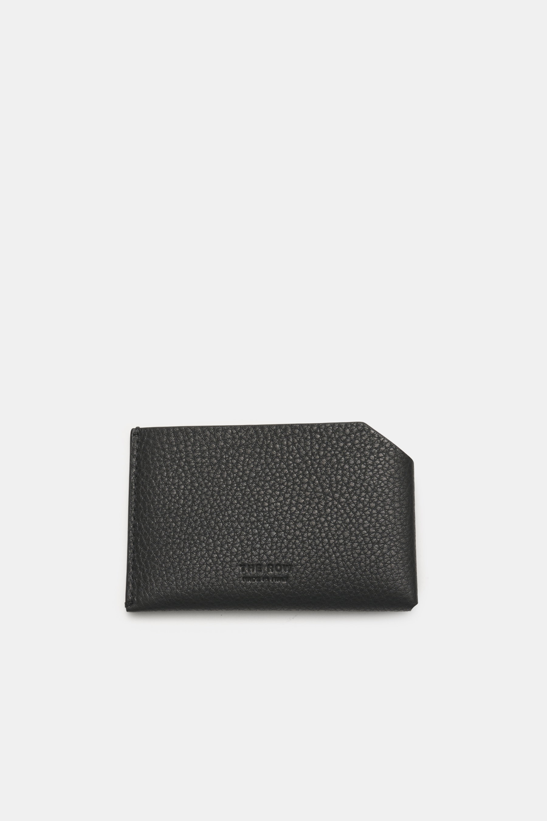 Top-down view of The Row Card case 'CC Wallet' black in finely grained leather, showing embossed logo and angled slip pocket.

<p>An accessory of timeless elegance: This card case from THE ROW embodies purist luxury – with flawless design, it stylishly an