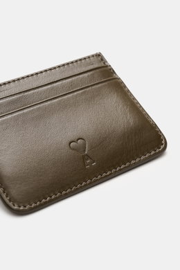 Close-up angled view of Ami Paris Card holder khaki in fine smooth leather with five card slots and embossed logo.

<p>Stylish everyday accessory: This card holder by AMI PARIS impresses with timeless design and keeps your most important cards elegant and