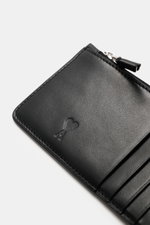 Close-up angled view of Ami Paris Card holder black in finely grained calf leather with embossed logo and zipper detail.

Description: 
<p>Stylish everyday accessory: This card holder from AMI PARIS impresses with timeless design and keeps your most impor