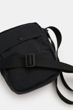 Front-close-up view of the Stone Island Crossbody Bag 'Marsupio Tracolla' schwarz in black cotton poplin with adjustable strap, exterior pockets, and iconic Windrosen patch, compact and sturdy for urban use. Practical and stylish: The crossbody bag 'Marsu