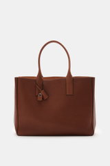 Tom Ford Shopper rotbraun aus genarbtem Kalbleder, frontale Nahaufnahme mit silberner Hardware, Tragegriffen, Logoprägung und Schlüssel-Schloss.
