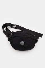 C.P. Company Belt bag black shown from above, compact, piece-dyed, water repellent microfibre with adjustable strap and signature lens.