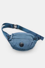 C.P. Company Belt bag grey blue shown from above, compact garment-dyed water-repellent microfiber with adjustable strap, zipper compartments, padded back, crinkle look, and lens detail. Always with you on excursions and in the city.