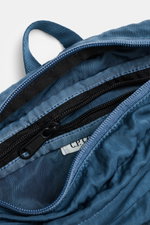 Close-up top view of the C.P. Company Belt bag grey blue showing the water-repellent microfiber fabric, zipper, and inner pocket.