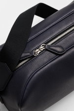 Close-up angled view of The Row Crossbody bag 'Jerome' navy, showing finely grained leather, zipper, and black adjustable strap. Stylish eye-catcher from THE ROW: The practical crossbody bag impresses with timeless design and becomes the ideal companion f