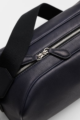 Close-up angled view of The Row Crossbody bag 'Jerome' navy, showing finely grained leather, zipper, and black adjustable strap. Stylish eye-catcher from THE ROW: The practical crossbody bag impresses with timeless design and becomes the ideal companion f