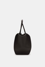 The Row Tote bag 'Marlo' dark brown shown from a front view, made of finely grained leather, spacious with zippered and slip pockets, embossed logo, soft cotton lining, approx. 43x20x31 cm. Stylish all-rounder by THE ROW: The practical tote bag impresses 