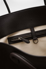 Close-up top-down view of The Row Tote bag 'Marlo' dark brown showing finely grained leather trim, zippered inner pocket, and soft cotton lining.

Additional description: 
<p> Stylish all-rounder by THE ROW: The practical tote bag impresses with timeless 