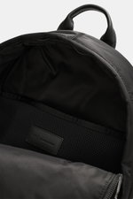 A close-up view from above of the open main compartment of the Ami Paris Backpack 'Marcel' black, featuring water-repellent canvas made of high-quality microfiber, a smooth handle, silver-colored hardware, adjustable padded shoulder straps, logo detail ma