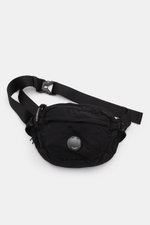 C.P. Company Belt bag black shown from above, compact piece-dyed water repellent microfibre with adjustable strap, zip compartments, lens detail.