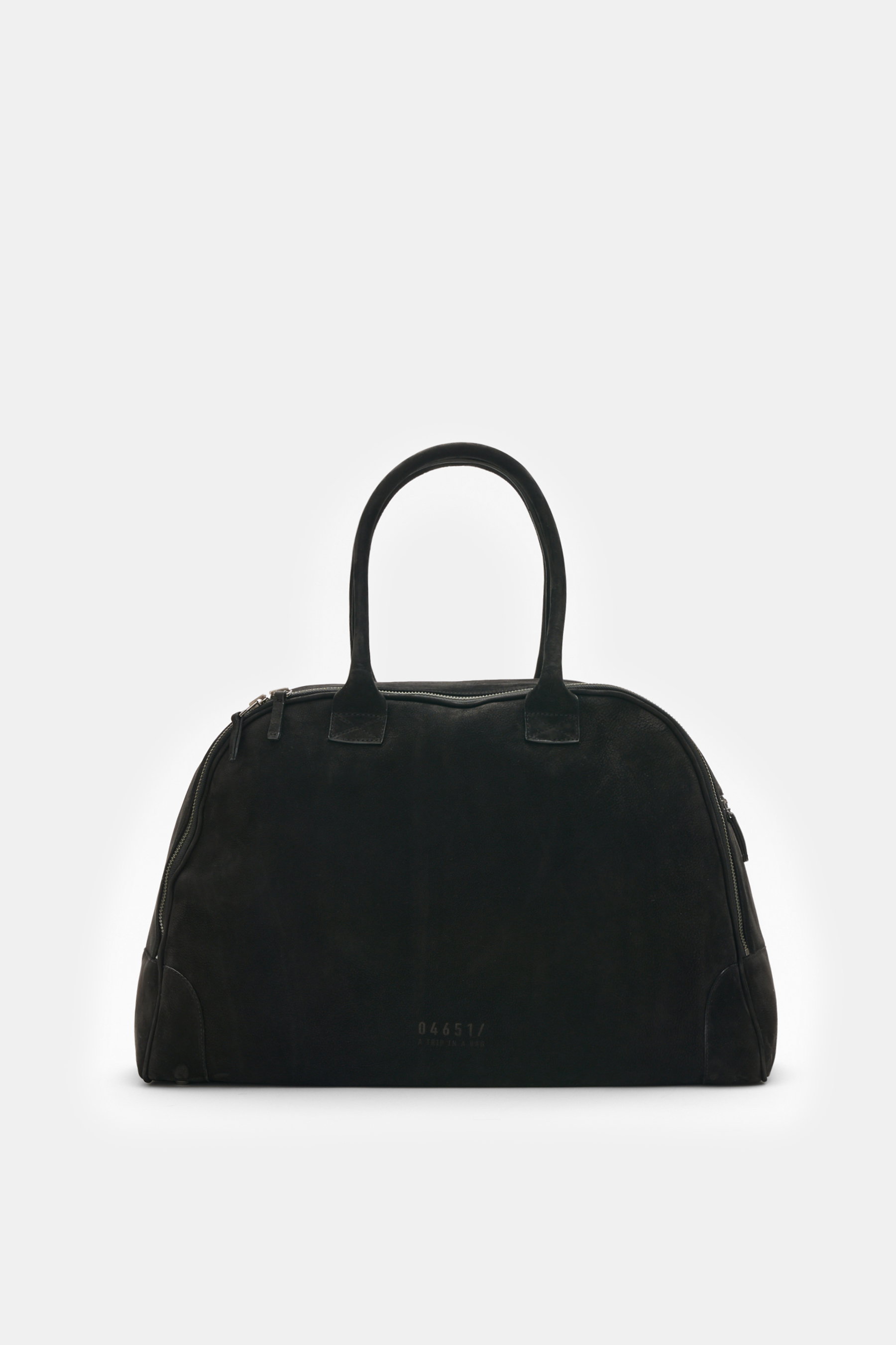 Black suede weekender bag photographed from the front, showing handles, silver hardware, and embossed 04651/ A trip in a bag logo. When it's time for your next holiday, the "04651/ A trip in a bag Weekender '356 Bag' black" in fine suede is perfect for ha