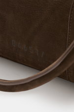 Close-up inside view of the dark brown 04651/ A trip in a bag Weekender '3 Day Bag' showing soft nubuck leather with 04651/- embossing, robust handles, and stitching. Features include silver-colored hardware, two-way zipper, small address compartment, spa