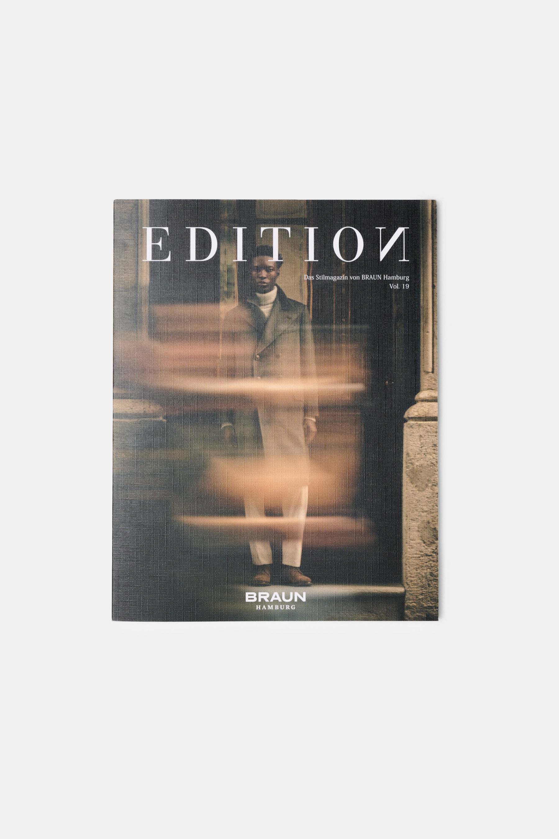 Front view of Edition EDITION Magazine Autumn 2026 Vol. 19 cover showing a man in elegant menswear blurred by motion, reflecting timeless elegance and craftsmanship. Discover Vol. 19 of EDITION – a magazine blending fashion, travel, and attitude, dedicate