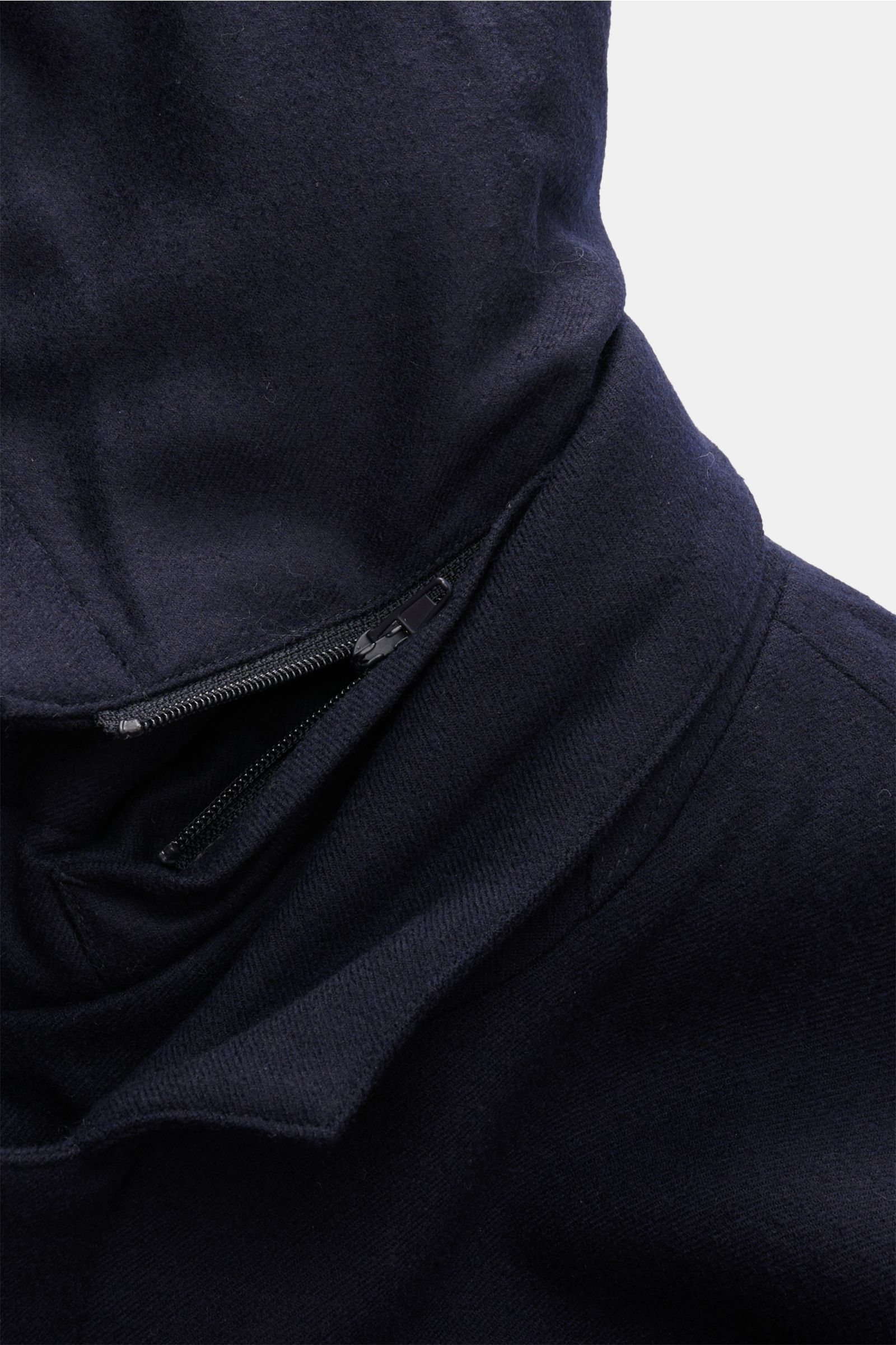 Close-up front view of the navy Montecore Short down coat showing the detachable double front zipper and elastic virgin wool fabric.

An elegant essential for winter: This down jacket by MONTECORE is warm and comfortable, with an elegant silhouette. Th