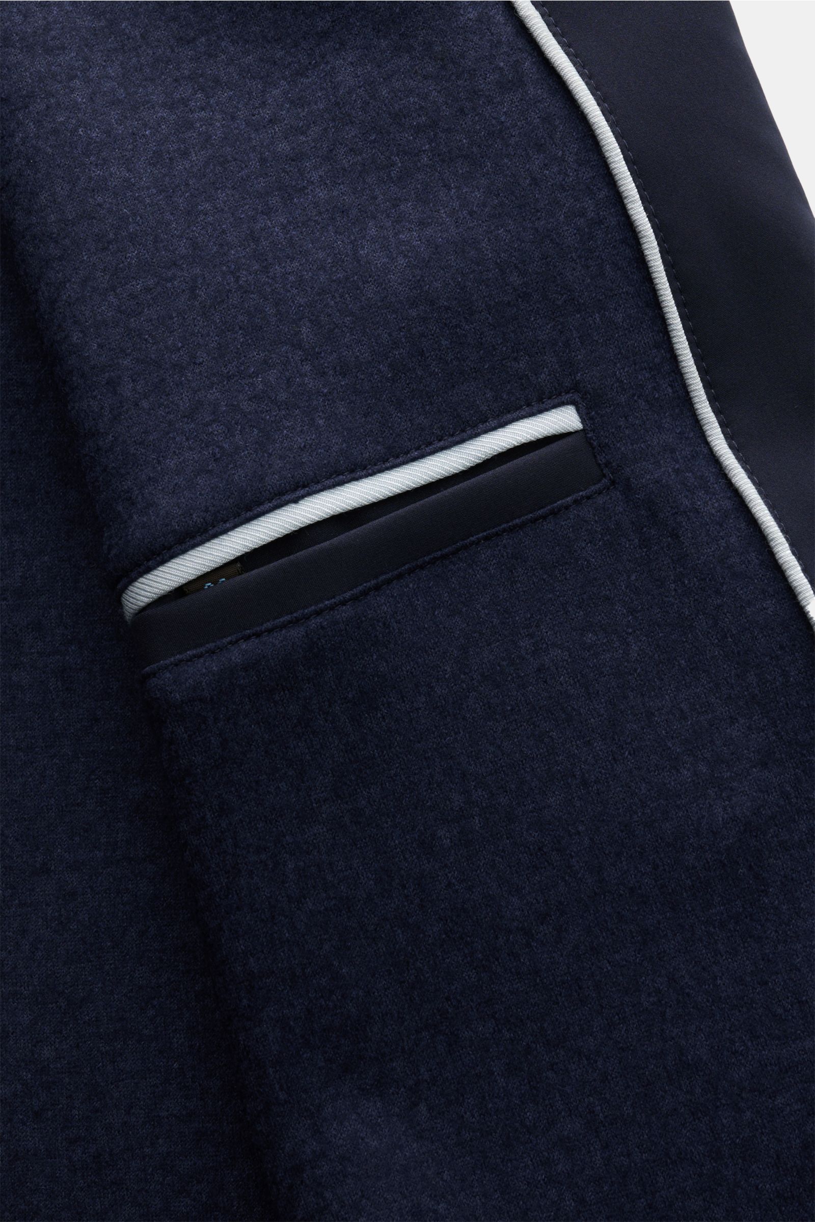 Close-up front view of the Colombo Mantel navy made from high-quality microfiber with a smooth feel, featuring a slim fit, five-button placket, turn-down collar, and slanted welt pockets, lined with a soft cashmere and silk blend for luxury and comfort. 