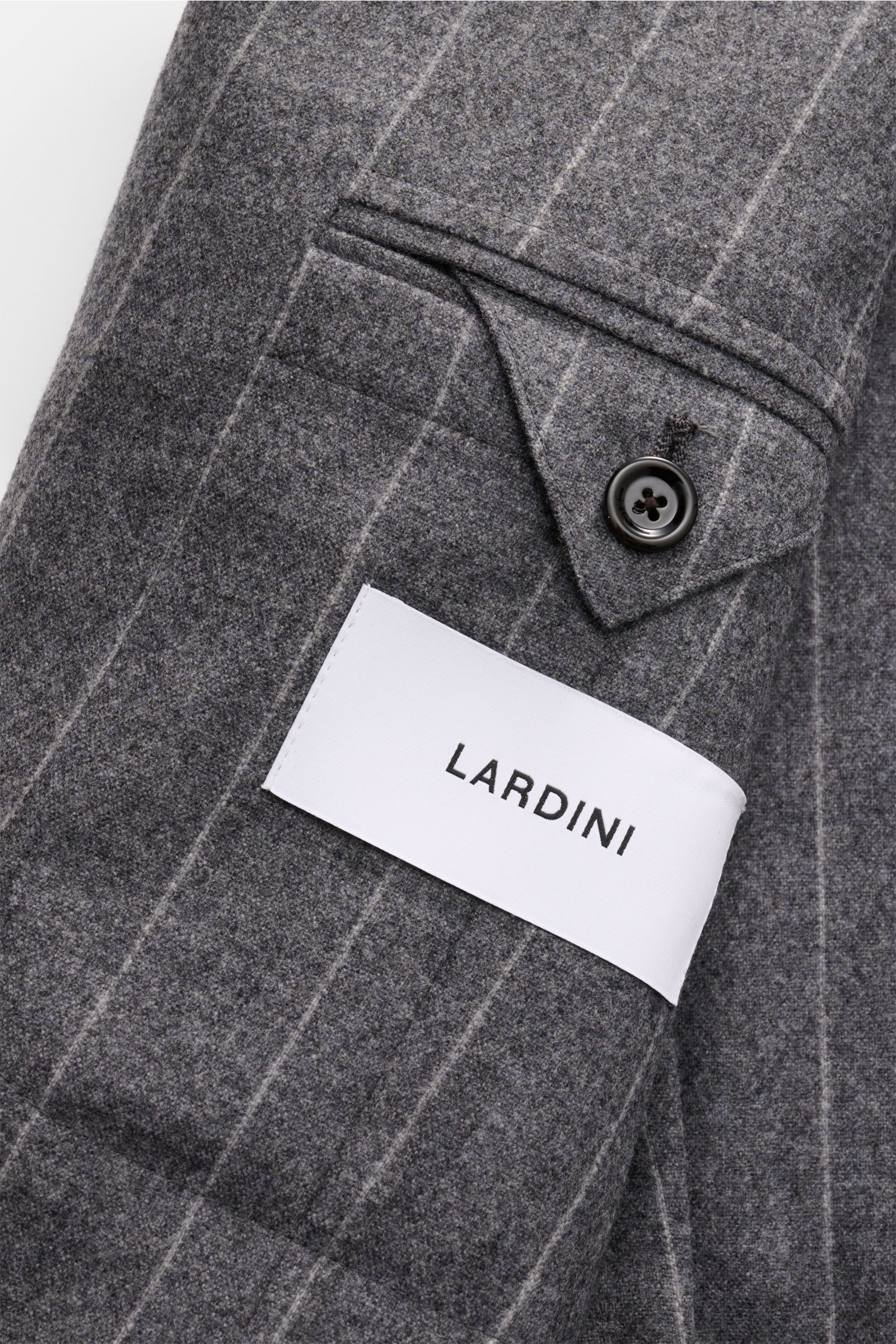 Close-up view of a gray striped Lardini Anzug grau gestreift sleeve made from a soft wool and cashmere blend, showing a buttoned cuff and label.