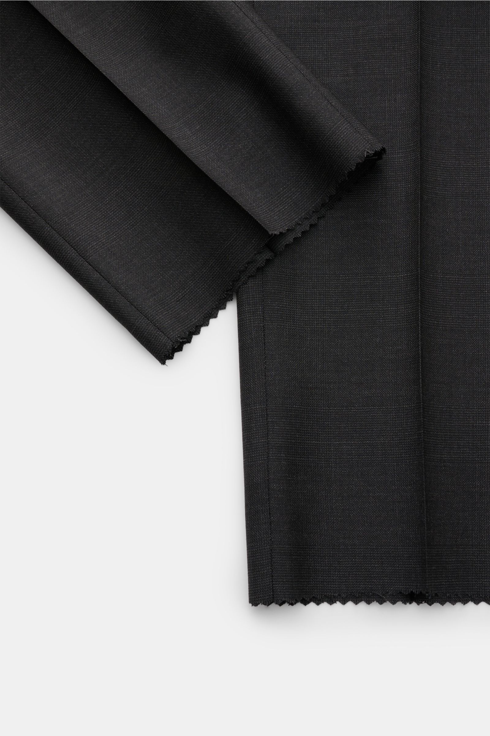 Close-up front view of Corneliani Anzug anthrazit meliert fabric swatches in pure virgin wool with a fine textured melange and subtle weave structure, showcasing the material's elegant and timeless quality.

