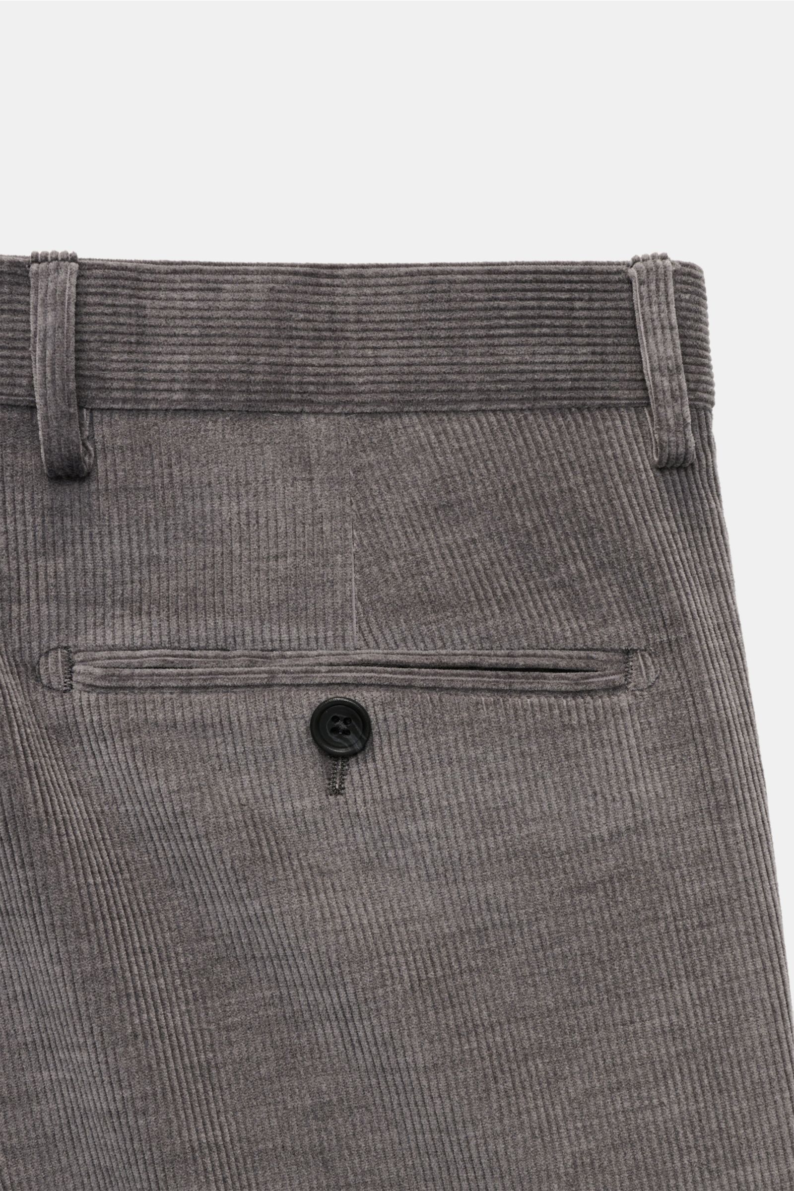 Close-up from the back of the beige Tagliatore Cordanzug showing the corduroy fabric, waistband with belt loops, and a single buttoned welt pocket.